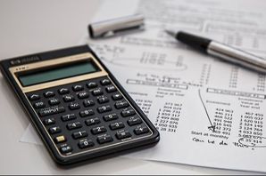 calculator and financial documents for financial IT services
