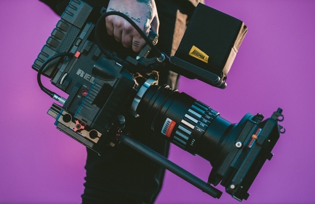 media video camera on purple background