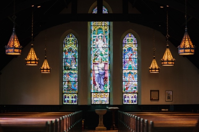 interior of church with stained glass windows